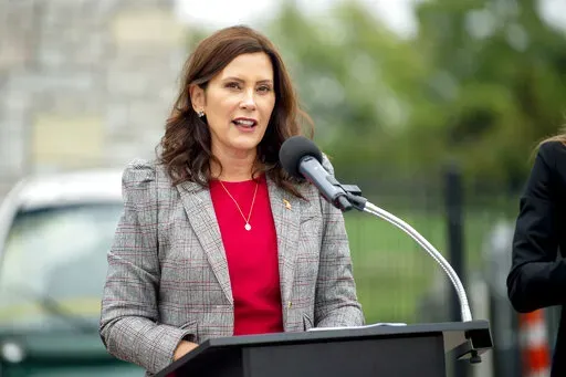 Michigan Gov. Gretchen Whitmer announces the first round of Michigan Mobility Funding Platform grants on Sept. 15, 2021, at the GM Mobility Research Center at Kettering University in Flint, Mich. The plot to kidnap Whitmer represents a growing anger in U.S. politics, and violence – both physical and non-physical – that is disproportionately aimed at women elected officials and candidates, and particularly women of color. (Jake May/The Flint Journal via AP, File)