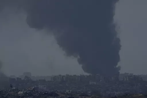 Smoke rises following an Israeli bombardment in the Gaza Strip, as seen from southern Israel,, Friday, Dec. 8, 2023. (AP Photo/Maya Alleruzzo)