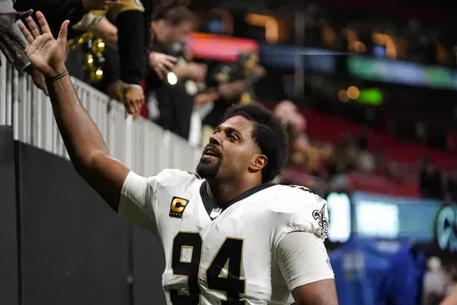 New Orleans Saints defensive end Cameron Jordan (94) greets fans after an NFL football game against the Atlanta Falcons, Sunday, Jan. 9, 2022, in Atlanta. The New Orleans Saints won 30-20. (AP Photo/Brynn Anderson)