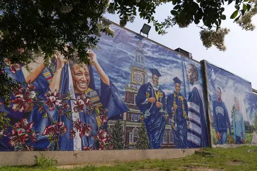 A graduation themed printed mural is seen on the Howard University campus, July 6, 2021, in Washington. At least six historically Black universities in five states and the District of Columbia were responding to bomb threats Monday, Jan. 31, 2022 with many of them locking down their campuses for a time. Howard University was also the subject of a bomb threat before dawn, but later gave an all-clear to students and staff, WTOP reported. (AP Photo/Jacquelyn Martin)