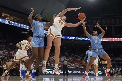 Texas forward Taylor Jones (44) grabs a rebound over Southern guard Aleighyah Fontenot (2) during the first half of an NCAA college basketball game in Austin, Texas, Wednesday, Dec. 11, 2024. (AP Photo/Eric Gay)