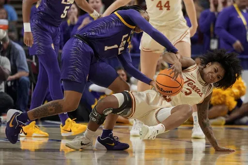 LSU guard Mjracle Sheppard vies for the ball with Texas guard Rori Harmon during the first half during of an NCAA college basketball game in the semifinals of the Southeastern Conference tournament, Saturday, March 8, 2025, in Greenville, S.C. (AP Photo/Chris Carlson)