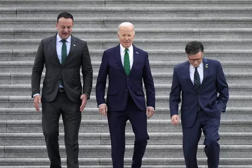 From left, Irish Prime Minister Leo Varadkar, President Joe Biden, and Speaker of the House Mike Johnson, R-La., walk down the steps following the annual St. Patrick's Day gathering at the Capitol in Washington, Friday, March 15, 2024. (AP Photo/J. Scott Applewhite)