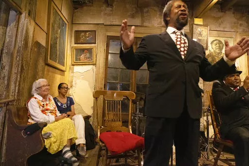 Sandra Jaffe, far left, who along with her husband, Allan, owned and managed Preservation Hall since the early 1960s, watches trombonist Freddie Lonzo sing to the crowd gathered June 10, 2021, in New Orleans, for the reopening of the venue since the coronavirus lockdown. Sandra Jaffe who introduced countless people to jazz through the intimate French Quarter venue over six decades, has died on Monday, Dec. 27, 2021, her son Ben Jaffe, creative director of the Preservation Hall Jazz Band, said on