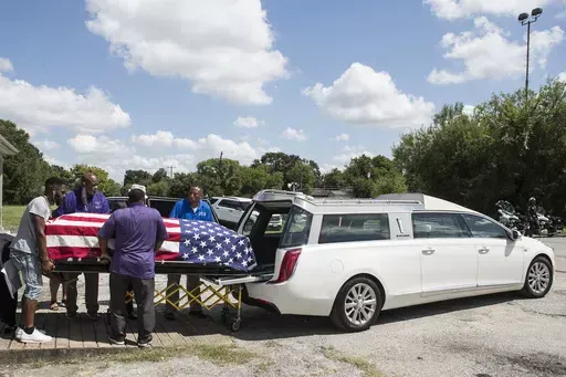 The body of New Orleans Police detective Everett Briscoe is placed into a hearse before it is escorted from the Respect for Life Funeral Home for the journey back to New Orleans, Tuesday, Aug. 24, 2021, in Houston. Frederick Jackson has pleaded guilty in the fatal shooting of off-duty officer Briscoe and his friend during a holdup at a Houston restaurant in 2021, prosecutors announced Wednesday, May 15, 2024. (Brett Coomer/Houston Chronicle via AP)