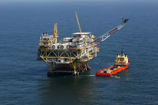 A rig and supply vessel are pictured in the Gulf of Mexico, off the cost of Louisiana on April 10, 2011. A judge’s order that forced the Biden administration to resume sales of oil and gas leases on federal land and waters was vacated on Wednesday, Aug. 17, 2022, by a federal appeals court in New Orleans. (AP Photo/Gerald Herbert, File)