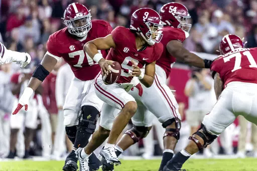 Alabama quarterback Bryce Young (9) rolls out against Mississippi State during the second half of an NCAA college football game Saturday, Oct. 22, 2022, in Tuscaloosa, Ala. (AP Photo/Vasha Hunt)