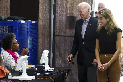 President Joe Biden arrives to cast his vote during early voting for the 2022 U.S. midterm elections with his granddaughter Natalie Biden, a first-time voter, at a polling station in Wilmington, Del., Saturday, Oct. 29, 2022. (Tasos Katopodis/Pool Photo via AP)