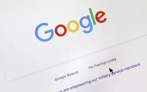 A cursor moves over Google's search engine page, Aug. 28, 2018, in Portland, Ore. Good news for all the password-haters out there: Google has taken a big step toward making them an afterthought by adding “passkeys” as a more straightforward and secure way to log into its services. (AP Photo/Don Ryan, File)