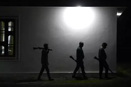 Village Defense Group members patrol during night at Muradpur village in Rajouri, India, Feb. 8, 2023. Days after seven Hindus were killed in the village in disputed Kashmir, hundreds of residents staged protests across the region's Hindu-dominated areas. In response, Indian authorities revived a government-sponsored militia and began rearming and training villagers. The militia, officially called the “Village Defense Group,” was initially formed in the 1990s as the first line of defense aga