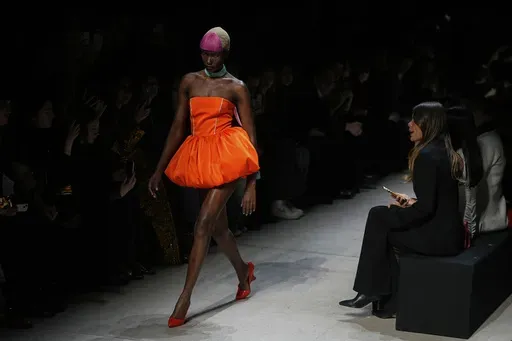 A model wears a creation by Russian brand Bitte_Ruhe on a runway of the Moscow Fashion Week in Moscow, Russia, Sunday, March 16, 2025. (AP Photo/Pavel Bednyakov)