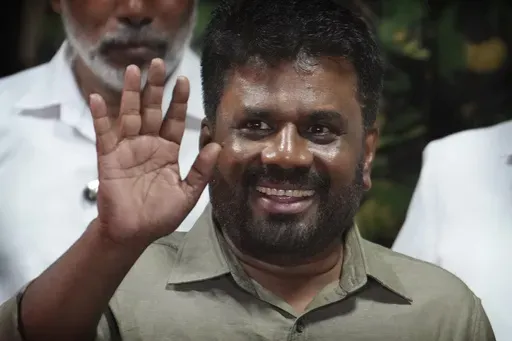 FILE -Marxist lawmaker Anura Kumara Dissanayake waves as he leaves from the election commission office after winning Sri Lankan presidential election, in Colombo, Sri Lanka, Sept. 22, 2024. (AP Photo/Rajesh Kumar Singh, File)