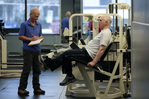 Dr. Grover Smith, right, works out with exercise scientist Dr. Irv Rubenstein, left, at STEPS Fitness, Wednesday, Feb. 12, 2025, in Nashville, Tenn. (AP Photo/George Walker IV)