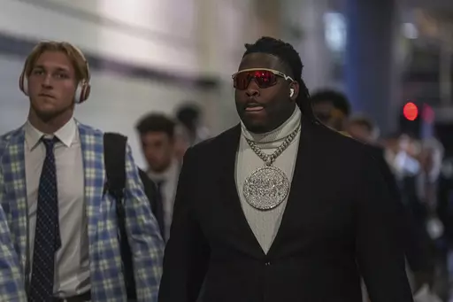Texas defensive lineman T'Vondre Sweat (93) arrives ahead of the Sugar Bowl CFP NCAA semifinal college football game against Washington, Monday, Jan. 1, 2024, in New Orleans. (Aaron E. Martinez/Austin American-Statesman via AP)