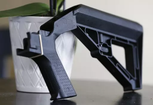 A bump stock is displayed on March 15, 2019, in Harrisonburg, Va. A Trump administration ban on bump stocks, devices that enable a shooter to rapidly fire multiple rounds from semi-automatic weapons after an initial trigger pull, was struck down Friday, Jan. 6, 2023, by a federal appeals court in New Orleans. (AP Photo/Steve Helber, File)