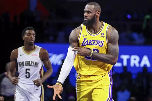 Los Angeles Lakers forward LeBron James (23) celebrates after making a 3-point basket against the New Orleans Pelicans during the first half of a semifinal in the NBA basketball In-Season Tournament, Thursday, Dec. 7, 2023, in Las Vegas. (AP Photo/Ian Maule)