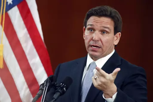 Florida Gov. Ron DeSantis answers questions from the media in the Florida Cabinet following his State of the State address during a joint session of the Senate and House of Representatives Tuesday, March 7, 2023, at the Capitol in Tallahassee, Fla. A stricter abortion ban under consideration for Florida could have practical implications for women throughout the South and political implications forDeSantis. (AP Photo/Phil Sears, File)