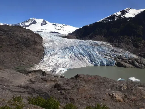 Chunks of ice float on Mendenhall Lake in front of the Mendenhall Glacier on Monday, May 30, 2022, in Juneau, Alaska. A study of all of the world's 215,000 glaciers published on Thursday, Jan. 5, 2023, finds even if with the unlikely minimum warming of only a few tenths of a degrees more, the world will lose nearly half its glaciers by the end of the century. With the warming we're now on track to get, the world will lose two-thirds of its glaciers and overall glacier mass will drop by one-third