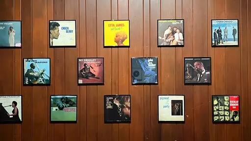 Framed album covers appear on the wall at Chess Records in Chicago on Feb. 27, 2022. Some of the biggest names in blues recorded hits in Chess' recording studio, including, Muddy Waters, Chuck Berry' and Bo Diddley. (Kim Curtis via AP)