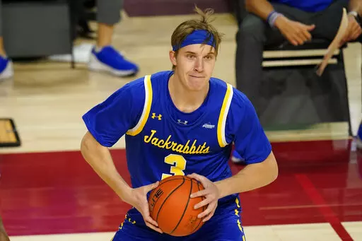 South Dakota State guard Baylor Scheierman looks to pass during the second half of an NCAA college basketball game against Iowa State, Wednesday, Dec. 2, 2020, in Ames, Iowa. Baylor Scheierman’s decision to return to his home state and play for Creighton after three stellar seasons at South Dakota State gave Creighton one of the nation’s more versatile players.(AP Photo/Charlie Neibergall, File)