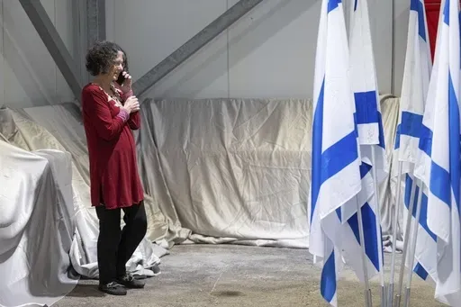 This handout photo provided by the Israel Prime Minister Office shows Shoshan Haran speaking on the phone upon her arrival in Israel after being freed. Shoshan was one of the 13 Israeli hostages that Hamas released late Saturday, Nov. 25, 2023, in the second round of swaps under a cease-fire deal. Step by step, the newly freed and their families are testing the ground for a path to recovery. No one, including the physicians and psychologists who have been treating them, is sure how to get there 