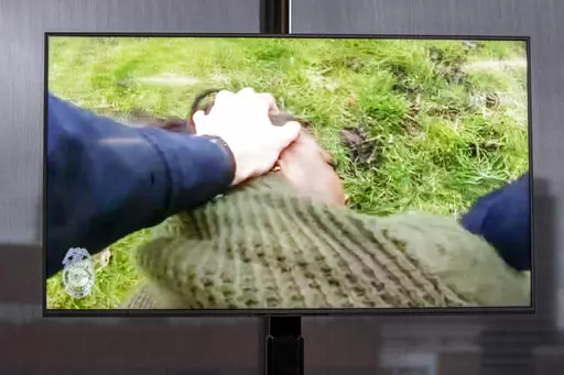 A TV display shows video evidence of a Grand Rapids police officer struggling with and shooting Patrick Lyoya at Grand Rapids City Hall on Wednesday, April 13, 2022. Lyoya, 26, was shot and killed about 8:10 a.m., on April 4, after what police said was a traffic stop. (Grand Rapids Police Department)