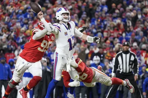 Kansas City Chiefs defensive tackle Chris Jones (95) hits Buffalo Bills quarterback Josh Allen (17) causing a fumble during the second half of the AFC Championship NFL football game, Sunday, Jan. 26, 2025, in Kansas City, Mo. (AP Photo/Ashley Landis)