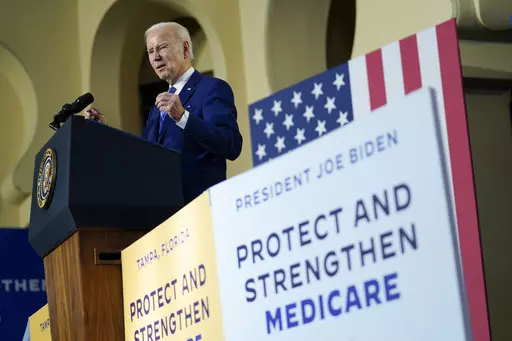 President Joe Biden speaks about his administration's plans to protect Social Security and Medicare and lower healthcare costs, Thursday, Feb. 9, 2023, at the University of Tampa in Tampa, Fla. Biden is trumpeting Medicare’s new powers to negotiate directly with drugmakers on the cost of prescription medications, but a new poll from The Associated Press-NORC Center for Public Affairs Research shows that any immediate political boost that Biden gets may be limited. (AP Photo/Patrick Semansky, F