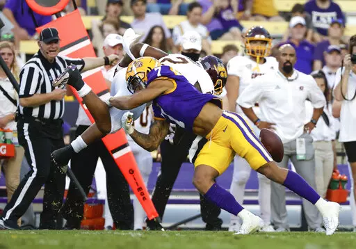 LSU cornerback Derek Stingley Jr. (7) forces a fumble by Central Michigan running back Darius Bracy (2) during the first quarter of an NCAA college football game in Baton Rouge, La., Sept. 18, 2021. Stingley was selected by the Houston Texas with the third pick in the NFL draft Thursday, April 28. (AP Photo/Derick Hingle, File)