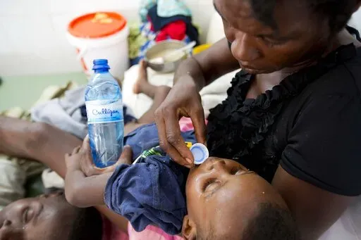 A boy diagnosed with cholera receives treatment at a cholera center in Anse D'Hainault, Haiti, Tuesday, Oct. 11, 2016. Haiti’s government on Sunday, Oct. 2, 2022, announced that at least eight people have died from cholera for the first time in three years, raising concerns about another potential catastrophic epidemic like the one that broke out a decade ago and killed nearly 10,000 people. (AP Photo/Dieu Nalio Chery, File)