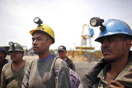 Miners helping in the rescue operation of fellow trapped miners are interviewed in San Juan de Sabinas, Coahuila state, Mexico, May 4, 2011. The administration of Mexican President Andres Manuel Lopez Obrador has resuscitated a form of coal mining so dangerous and primitive that both houses of Mexico’s Congress tried to ban it in 2012. (AP Photo/Alexandre Meneghini, File)