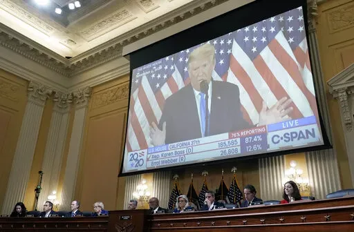 A video of then-President Donald Trump speaking is displayed as the House select committee investigating the Jan. 6 attack on the U.S. Capitol holds a hearing on Capitol Hill in Washington, Thursday, Oct. 13, 2022. In an extraordinary step, the House Jan. 6 committee on Thursday voted to subpoena former President Donald Trump. (AP Photo/J. Scott Applewhite, File)