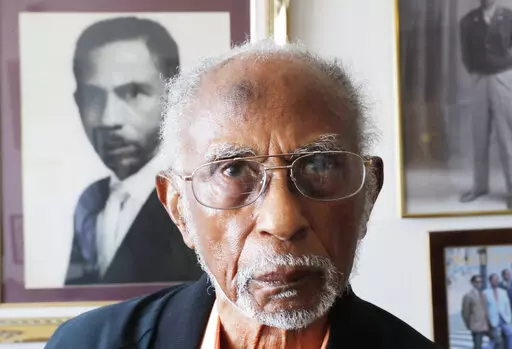 World War II veteran Johnnie Jones, Sr. poses for a portrait at his home in Baton Rouge, La., May 28, 2019. His goddaughter, Mada McDonald, tells WAFB-TV that Jones died on Saturday, April, 23, 2022, at a veterans' home in Jackson, La.  (AP Photo/Gerald Herbert, File)