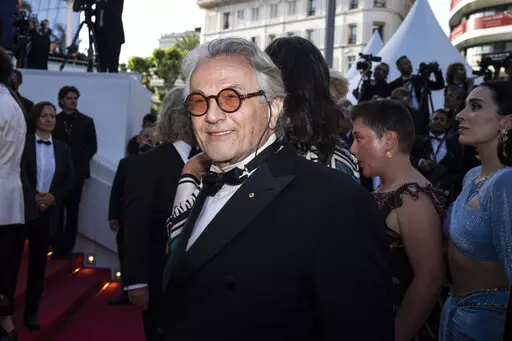 Director George Miller poses for photographers upon arrival at the premiere of the film 'Three Thousand Years of Longing' at the 75th international film festival, Cannes, southern France, Friday, May 20, 2022. (AP Photo/Petros Giannakouris)