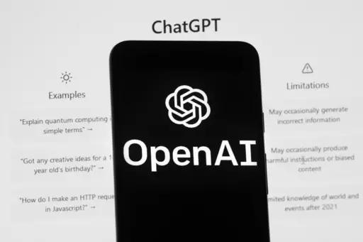 The OpenAI logo is seen on a mobile phone in front of a computer screen which displays the ChatGPT home Screen, on March 17, 2023, in Boston. ChatGPT's maker said Friday April 28, 2023 that the artificial intelligence chatbot is available again in Italy after the company met the demands of regulators who temporarily blocked it over privacy concerns. (AP Photo/Michael Dwyer, File)