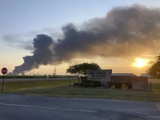 A plume of smoke drifts from the Marathon Petroleum refinery in Garyville, La., toward the Southeast Louisiana War Veterans Home in nearby Reserve, La.,. Friday, Aug. 25, 2023. A massive fire at a south Louisiana oil refinery sent a tower of black smoke billowing into the air above the Mississippi River on Friday, forcing nearby residents to evacuate for several hours as emergency crews battled the blaze. (AP Photo)