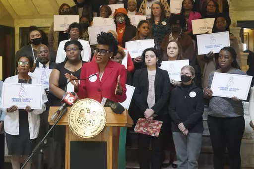 FIILE - Cassandra Welchlin, executive director of the Mississippi Black Women's Roundtable, speaks during a news conference about the group’s push for legislators to extend postpartum Medicaid from 60 days to 12 months, Jan. 26, 2023, at the Mississippi Capitol in Jackson. A Mississippi law that takes effect Saturday, July 1, 2023, authorizes a full year of postpartum Medicaid coverage. (AP Photo/Rogelio V. Solis, File)
