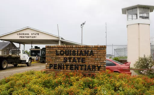 Vehicles enter the main security gate at the Louisiana State Penitentiary — Angola Prison, the largest high-security prison in the country in Angola, La., Aug. 5, 2008. In a federal court filing dated Monday, July 17, 2023, advocates said that juveniles held in a former death row building at the Louisiana prison for adults are suffering through dangerous heat and psychologically damaging isolation in their cells with little or no mental health care, inadequate schooling and foul water. In the 