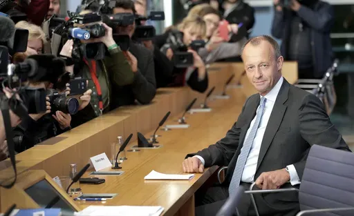 Friedrich Merz, right, member of the German Christian Democratic Party, arrives for a press conference in Berlin, Germany, Oct. 31, 2018. (AP Photo/Michael Sohn, File)