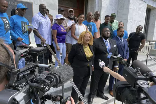 Attorneys and criminal justice advocates stand outside Louisiana's Supreme Court on May 10, 2022, after arguing that people convicted by nonunanimous juries should be granted new trials. Nonunanimous verdicts are no longer legal but state and federal courts have refused to make that policy retroactive in Louisiana, so advocates have turned to the state Legislature. (AP Photo/Kevin McGill, File)