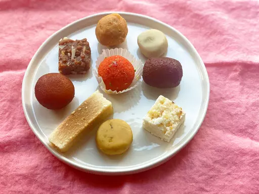 An assortment of sweets from an Indian food shop are displayed in New York on Oct. 19, 2022. These sweets are typically enjoyed on Diwali, the Hindu festival of lights. (Katie Workman via AP)