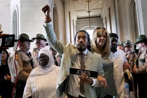 Metro Nashville Council member Zulfat Suara, left, and state Rep. Gloria Johnson, D-Knoxville, right, escort state Rep. Justin Jones, D-Nashville, center, back to the House chamber on April 10, 2023, in Nashville, Tenn. Lawmakers this year have kicked rival colleagues out of office in Tennessee and off the chamber floor in Montana. They have staged walkouts in Oregon and filibusters in Nebraska, where interactions are so fraught that some lawmakers say they’re unsure they can work together any