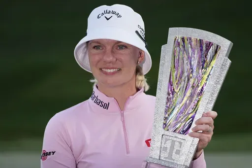 Madelene Sagstrom poses with the trophy after winning the LPGA T-Mobile Match Play golf tournament Sunday, April 6, 2025, in North Las Vegas, Nev. (AP Photo/John Locher)