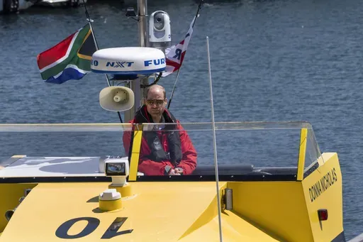 Britain's Prince William sails off with volunteers of the National Sea Rescue Initiative, at Simon's Town harbour nearCape Town, South Africa, Thursday, Nov. 7, 2024. (AP Photo/Jerome Delay, Pool)