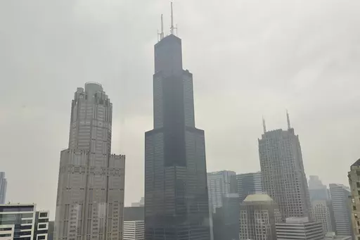 The Willis Tower (formerly Sears Tower) is pictured in downtown Chicago, where the air quality has been categorized "unhealthy" by the U.S. Environmental Protection Agency, on June 27, 2023. The EPA says extensive swaths of the northern United States awoke to unhealthy air quality Monday, July 17, or were experiencing it by midafternoon. Fine particle pollution caused by smoke from Canada’s wildfires is causing a red zone air quality index, meaning it is unhealthy for everyone. (AP Photo/Clair