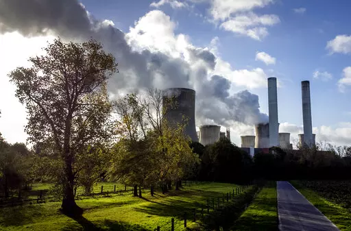 Steam rises from the coal-fired power plant Niederaussem, Germany, on Nov. 2, 2022. Researchers say efforts to remove carbon dioxide from the atmosphere aren't being scaled up fast enough and can’t be relied on to meet crucial climate goals. A report published Thursday by scientists in Europe and the United States found that new methods of CO2 removal currently account for only 0.1% of the 2 billion metric tons sucked from the atmosphere each year. (AP Photo/Michael Probst, File)