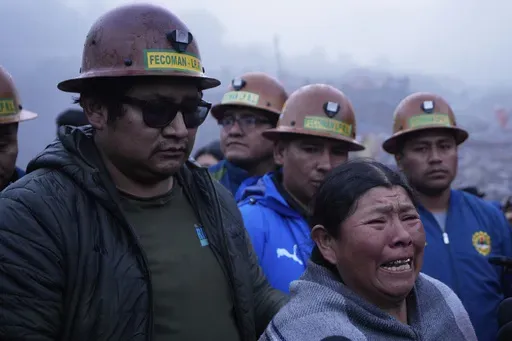 Delia Acarapi, who says her daughter died in an explosive attack, cries near the Hijos de Ingenio gold mine in Yani, Bolivia, Thursday, April 3, 2025. (AP Photo/Juan Karita)