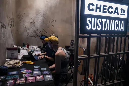 A man waits for his drug's lab results at the Check Your Substance booth that offers free drug testing, where people can confirm their drug does not contain adulterants or fentanyl, at a three-day electronic music festival in Mexico City, late Friday, Jan. 30, 2025. (AP Photo/Aurea Del Rosario)