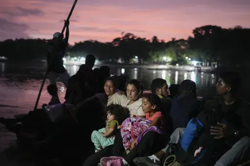 Severe shortages and one of the world’s highest inflation rates have helped drive nearly 8 million Venezuelans from the petrostate of 28 million people, including Venezuelan migrant Lisbeth Contreras, who hugs her children as she crosses the Suchiate River on the border between Guatemala and Mexico, on Oct. 26, 2024. (AP Photo/Matias Delacroix, File)