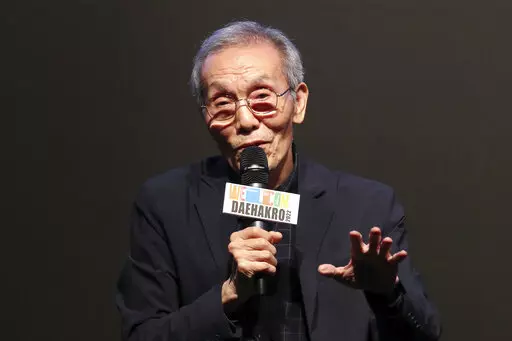 South Korean actor Oh Young-soo speaks during a press conference at the Welcome Daehakro Festival 2022 in Seoul, South Korea, Sept. 21, 2022. Award-winning “Squid Game” actor Oh will stand trial on charges of indecent assault after a woman accused him of inappropriately touching her in 2017, a South Korean court said. (Park Jin-hee/Newsis via AP)